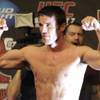 Photo: Chael Sonnen flexes after weighing in for UFC 117 