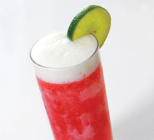 Brazil has a national cocktail and it's called the caipirinha. Made with cachaca, a spirit that, like rum, is derived from sugarcane, the caipirinha is as synonymous with Brazil as the mint julep is with Louisville, or the Manhattan is with the New York City borough. Rhumbar's take mixes Leblon cachaca with strawberries, lime and cane sugar, then tops it all off with lime espuma - or as you might refer to it after three or four strawberry caipirinhas, the tasty, foamy stuff.