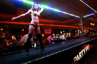 Krystle Lehr entertains gamblers Friday, Aug. 20, 2010, at Mandalay Bay's 