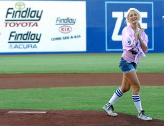 Holly Madison reacts after throwing the opening pitch at the Las Vegas 51s minor league baseball game at Cashman Field on Aug. 24, 2010.