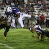 Photo: Boulder City's Ty Washburn trips up Basic's Darian