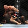 Randy Couture, top, in action against James Toney during a UFC heavyweight fight on Saturday, Aug. 28, 2010, at the TD Garden in Boston. Couture defeated Toney by first-round triangle choke.