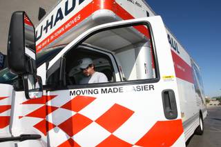 David Stevens, 35, studies the equipment inside the cab of the 26-foot truck he rented Tuesday to move his father-in-law from Henderson to San Francisco.