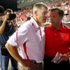 UNLV head coach Bobby Hauck talks with Athletic Director Jim Livengood following their game against Wisconsin Saturday, September 4, 2010 at Sam Boyd Stadium. Wisconsin won the game 41-21. UNLV head coach Bobby Hauck talks with Athletic Director Jim Livengood following their game against Wisconsin Saturday, September 4, 2010 at Sam Boyd Stadium. Wisconsin won the game 41-21.