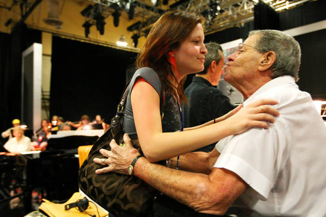 Danielle Lewis, 18, gives her dad, Jerry Lewis, a kiss during rehearsal for the 45th Annual Jerry Lewis MDA Labor Day Telethon Sunday night at the South Point. This year's telethon hopes to raise $70 million to surpass 2009's earnings of $60 million in the fight against muscular dystrophy.