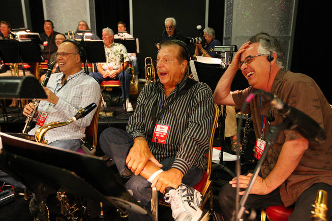 Members of Jerry Lewis' band, from right, Sal Lozano, Gene Cipriano and Bob Sheppard, crack up laughing at Jerry Lewis' jokes during rehearsal for the 45th Annual Jerry Lewis MDA Labor Day Telethon Sunday night at the South Point. This year's telethon hopes to raise $70 million to surpass 2009's earnings of $60 million in the fight against muscular dystrophy.