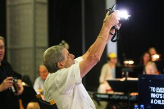 Jerry Lewis shoots a photo of his band to determine the height of their platforms during rehearsal for the 45th Annual Jerry Lewis MDA Labor Day Telethon Sunday night at the South Point.  This year's telethon hopes to raise $70 million to surpass 2009's earnings of $60 million in the fight against muscular dystrophy.