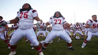 Members of the Liberty High football team perform the Haka dance prior to Friday's game at Palo Verde. Liberty, which lost by three points, is one of five Southeast Division teams in the Sun's top-10 rankings. Palo Verde is No. 2.