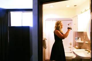 Tina Enard of Reno-based Urban Design Studio examines the current suite at the El Cortez September 8, 2010.
