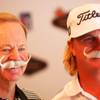 PGA TOUR Professional Player and UNLV graduate, Charley Hoffman, and UNLV golf head coach Dwaine Knight pose for a photo with UNLV Hey Reb mustaches during media day.to present details of the 2010 Justin Timberlake Shriners Hospitals for Children Open.