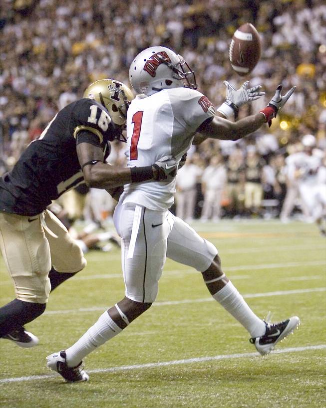 UNLV defensive back Will Chandler (1) intercepts in the end zone a pass intended for Idaho wide receiver Armauni Johnson (18) during the second quarter of Saturday's game at the Kibbie Dome in Moscow, Idaho. The Vandals knocked off the Rebels, 30-7, dropping UNLV to 0-3 on the season.