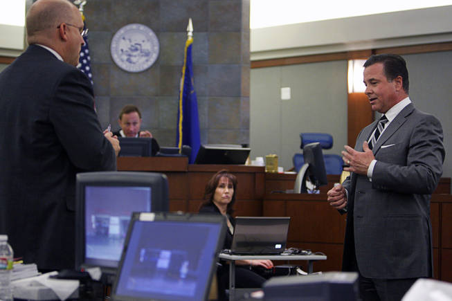 Christopher Villareale, right, who was shopping at Costco the day of the shooting and also is a concealed weapon permit holder, testifies during a coroner's inquest for Erik Scott at the Regional Justice Center Friday, September 24, 2010. Chief Deputy District Attorney Christopher Laurent is at far left.