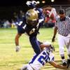 Foothill's Kyle Keplinger tries to leap over Basic's Dante Rodgers during their game in 2010. 