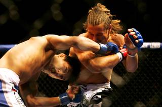 Urijah Faber and Takeya Mizugaki trade blows during their bout at WEC 52 Thursday, November 11, 2010 at the Palms.
