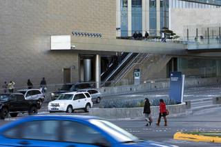 A pair of tourists cross illegally at the entrance to CityCenter on Wednesday, November 23, 2010. 