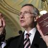 Photo: Senate Majority Leader Harry Reid holds a copy of Photo: Senate Majority Leader Harry Reid holds a copy of