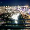 A private terrace of a Cosmopolitan guest room offers a view of the Bellagio Fountains and other properties along The Strip.