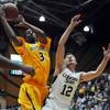 Photo: Desmar Jackson, left, rebounds the ball against Co Photo: Desmar Jackson, left, rebounds the ball against Co