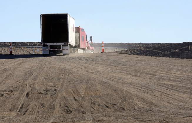 A semi tractor-trailer leaves after waste was off loaded in the Area 5 Radioactive Waste Management Site of the Nevada National Security Site (N2S2), previously the Nevada Test Site, about 65 miles northwest of Las Vegas on Feb. 1, 2011. The waste came from Oak Ridge, Tenn, about 2,200 miles away.