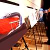 Photo: Invited guests look over conceptual renderings dur