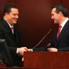 Secretary of State Ross Miller shakes Assemblyman John Oceguera's hand while handing him the gavel after Oceguera was named Assembly Speaker during the first day of the 2011 legislative session Monday, February 7, 2011 in Carson City.