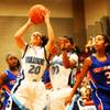 Photo: Simone Barber of Centennial rebounds over Bishop G Photo: Simone Barber of Centennial rebounds over Bishop G
