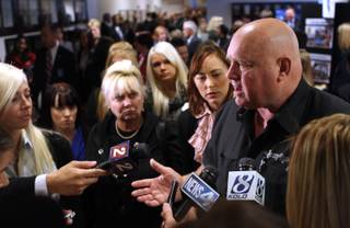 Moonlite Bunny Ranch brothel owner Dennis Hof answers the media questions on Tuesday, Feb. 22, 2011 at the Legislature in Carson City following a speech from U.S. Senate Majority Leader Harry Reid in which he proposed banning legal prostitution in the state. Hof and a number of his prostitutes and other brothel supporters attended the speech and called the idea 