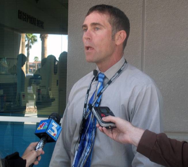 Metro Police Capt. Patrick Neville addresses the media about the standoff that ended in an officer-involved shooting. After about 12 hours of negotiations, SWAT officers entered the apartment unit where a 48-year-old man was holding a woman hostage. The suspect fired at SWAT officers, who returned fired and killed him.