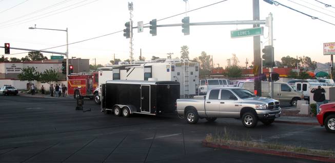 Metro Police SWAT officers fatally shot a 48-year-old man early Monday who was holding a woman hostage in her apartment on Charleston Boulevard in the eastern valley. Police said it appears the suspect randomly chose the woman and entered her unlocked apartment Saturday afternoon. SWAT members made entry after about 12 hours of negotiations.