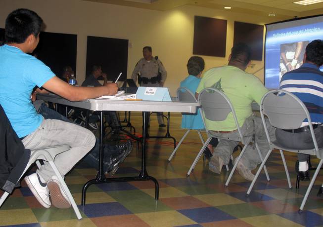Metro Police Officer Dave Cienega talks to students at the Hispanic Citizens Academy about the effects of heroin use. The goal of the Hispanic Citizens Academy is to bridge the gap between the Hispanic community and law enforcement. Police hope to educate Hispanic citizens about their rights and promote crime-fighting awareness during the 10-week academy.