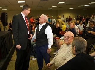Dave Rice, left, UNLV's new head basketball coach, chats with Regent Jack Schofield before an introductory news conference Monday, April 11, 2011. Former coach Jerry Tarkanian is seated at right.