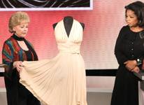 Debbie Reynolds and Oprah Winfrey with Marilyn Monroe's dress from The Seven-Year Itch. Debbie Reynolds and Oprah Winfrey with Marilyn Monroe's dress from The Seven-Year Itch.