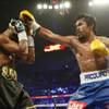 Shane Mosley (L) takes a punch from Manny Pacquiao during their WBO welterweight title fight at the MGM Grand Garden Arena on May 7, 2011. Shane Mosley (L) takes a punch from Manny Pacquiao during their WBO welterweight title fight at the MGM Grand Garden Arena on May 7, 2011.