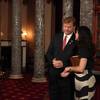 Photo: Sen. Dean Heller's wife, Lynne, whispers to him as Photo: Sen. Dean Heller's wife, Lynne, whispers to him as
