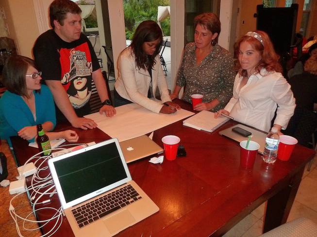 Asked to come up with the kind of school they'd like to see downtown, Zappos employees who volunteered to work on the education "track" for the company's sweeping downtown vision broke into groups Monday night.
From left to right is Ashley Kahr, Graham Kahr, Raven McClure, Dana Zumbo and Marie McCaslin.