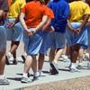 Photo: Juveniles hold their hands behind their backs as t Photo: Juveniles hold their hands behind their backs as t
