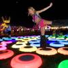 Dina Bronshteyn,31, of Orlando, Fla. jumps on lighted rings during the Electric Daisy Carnival at the Las Vegas Motor Speedway June 24, 2011. Dina Bronshteyn,31, of Orlando, Fla. jumps on lighted rings during the Electric Daisy Carnival at the Las Vegas Motor Speedway June 24, 2011.