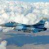 Photo: An F-16 Fighting Falcon Aggressor flies over the N Photo: An F-16 Fighting Falcon Aggressor flies over the N