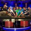 The "November Nine" reach for a championship bracelet after making it to the final table during the World Series of Poker $10,000 buy-in, no-limit Texas Hold 'em main event at the Rio early Wednesday morning July 20, 2011. The players will come back in November for the final table. From left are: Badih Bounahra of Belize, Phil Collins of Las Vegas, Matt Giannetti of Las Vegas, Pius Heinz of Germany, Sam Holden of Britain, Ben Lamb of Las Vegas, Anton Makiievskyi of Ukraine, Eoghan O'Dea of Ireland and Martin Staszko of the Czech Republic.
