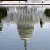 The U.S. Capitol is reflected in Washington Sunday, July 31, 2011.