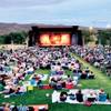 Photo: The audience lounges on blankets while awaiting th