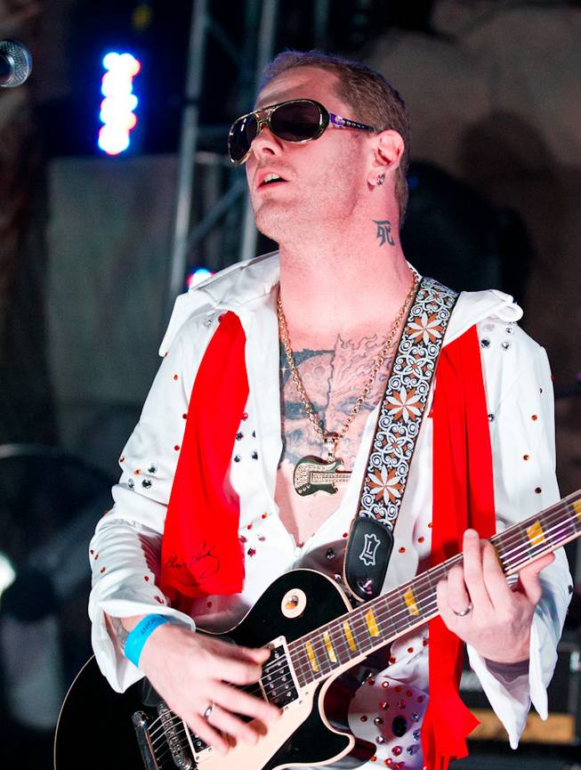 Corey Taylor, dressed as Elvis Presley, and his band perform poolside at the Beach Club at the Hard Rock Hotel on Aug. 5, 2011.