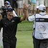 Former UNLV golfer Adam Scott celebrates with caddie Steve Williams Sunday after hitting his approach to the 18th green of the Bridgestone Invitational in Akron, Ohio. Scott finished at 17-under 263 and was flawless down the stretch to claim the World Golf Championship title.