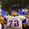 Photo: Bishop Gorman tackle Ron Scoggins, center, and run