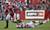 Wisconsin running back James White, left, runs for first down against UNVL's Kenny Brown during the first half of an NCAA college football game, Thursday, Sept. 1, 2011, in Madison, Wis.
