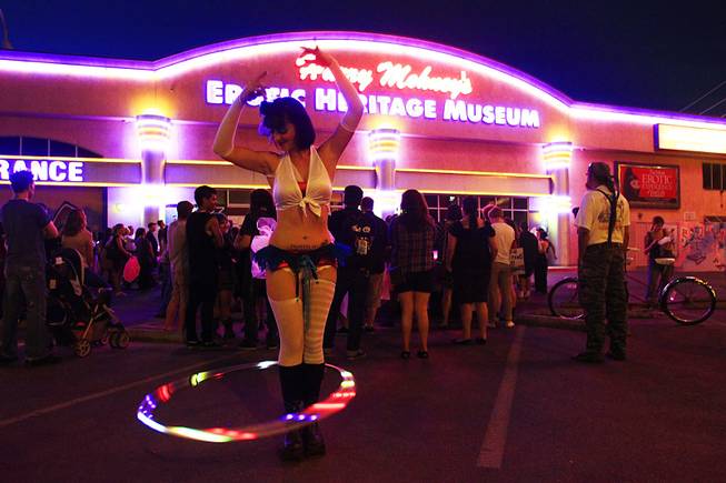 Nickole Schettino twirls a hula hoop as people gather at the Erotic Heritage Museum for Slut Walk Saturday, September 10, 2011.