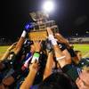 Photo: Green Valley players hoist the trophy after defeat Photo: Green Valley players hoist the trophy after defeat