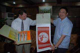 Clark County School District administrator Pat Skorkowsky receives a traditional paper cutting as a gift during the Green Valley High School marching band's trip to China.