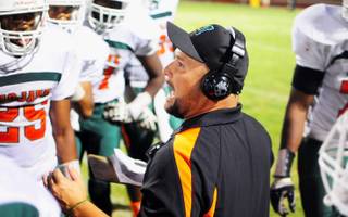 Coach Joe Delgado calls the play to his team. The Mojave High School Rattlers won their first game since the 2009-10 season on Friday, Sept. 24, 2011, against the Boulder City Eagles during their homecoming weekend.