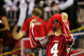 UNLV fan Alex Salvo reacts as Southern Utah University runs an interception back for a touchdown during the second half Saturday, September 24, 2011. Southern Utah beat UNLV 41-16.